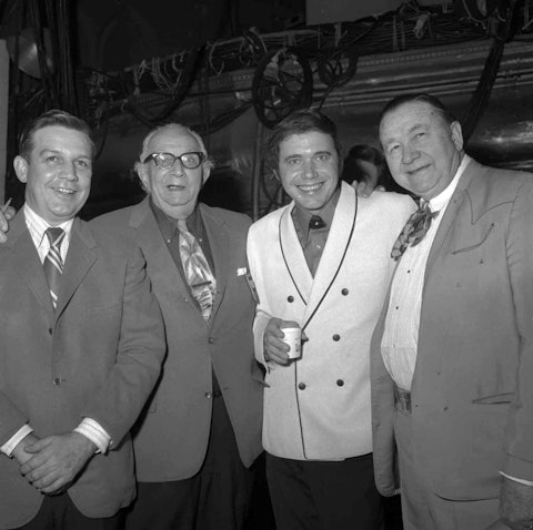 At the Opry (from left): Bud Wendell, Opry stage manager Vito Pellettieri, Bobby Bare, and Tex Ritter, 1960s. From the Hubert Long Collection.