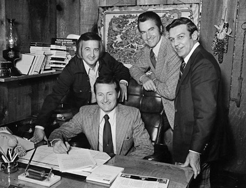 Grand Ole Opry bluegrass duo Jim & Jesse sign with Opryland Records in 1974. From left: Jim Bowen, Jesse McReynolds, Jim McReynolds, and Bud Wendell. From the Muleskinner News Collection.