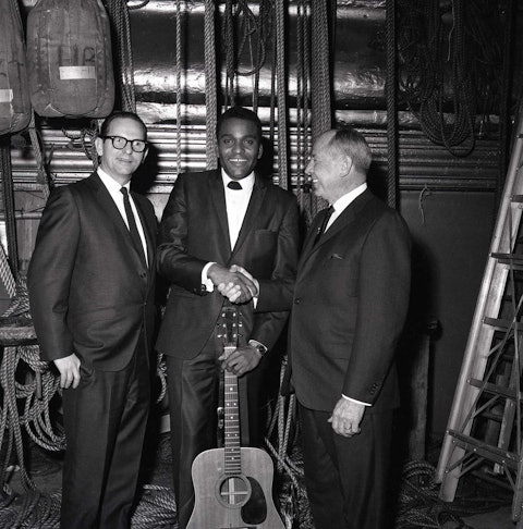 Backstage at the Grand Ole Opry, 1967 (from left): Pride’s manager Jack D. Johnson, Charley Pride, Opry manager Ott Devine. Photo by Walden S. Fabry Studios.