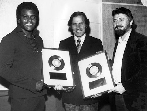 Charley Pride celebrates gold record sales awards with RCA label head Chet Atkins and producer “Cowboy” Jack Clement, 1973.