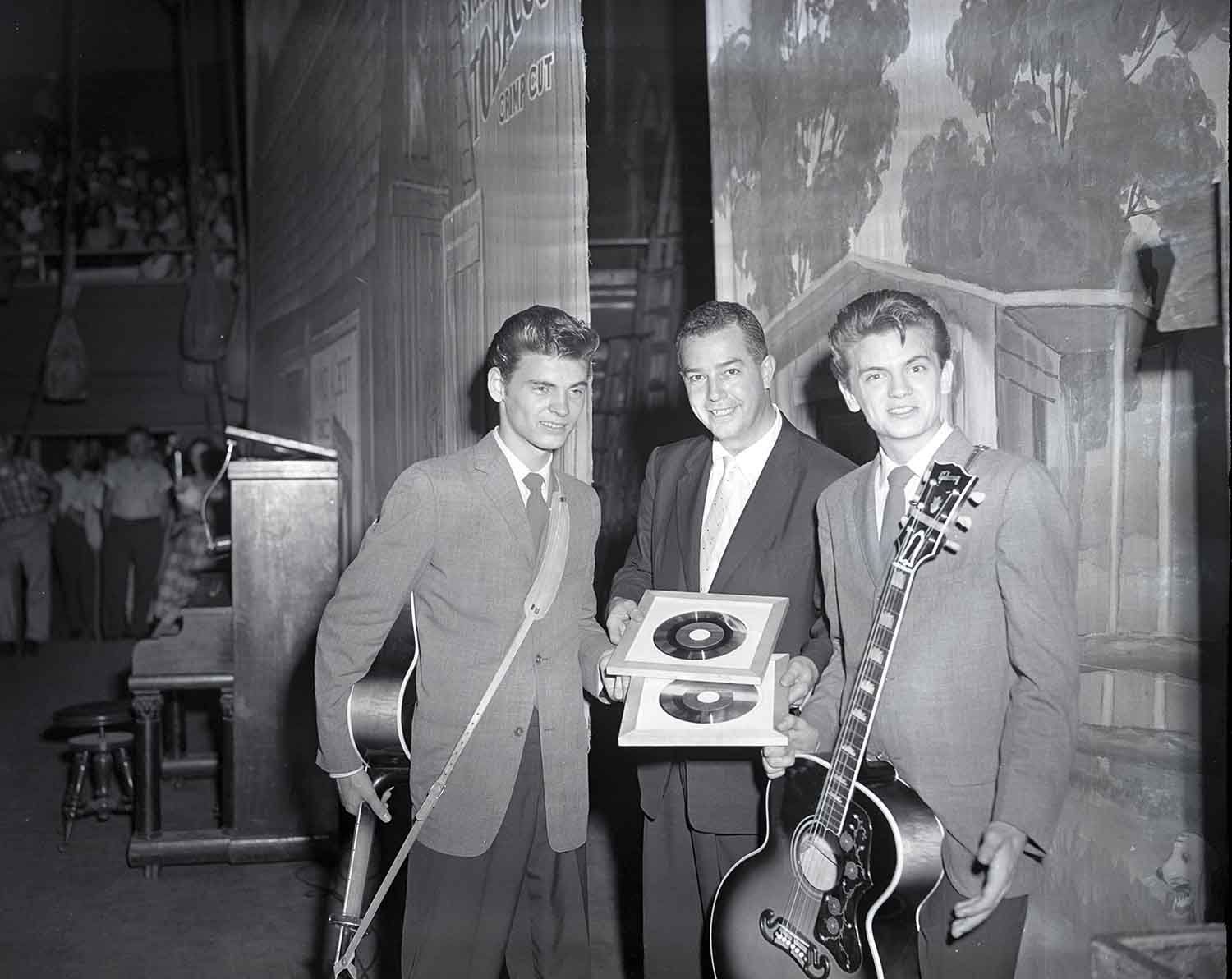 With Grand Ole Opry manager “D” Kilpatrick at the Opry, late 1950s. The Everly Brothers became members of the Opry on June 1, 1957. Photo by Elmer Williams.