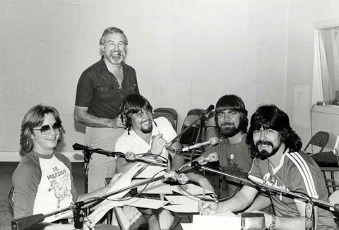 Ralph Emery (standing) doing a segment with Alabama on his syndicated radio show, 1981.