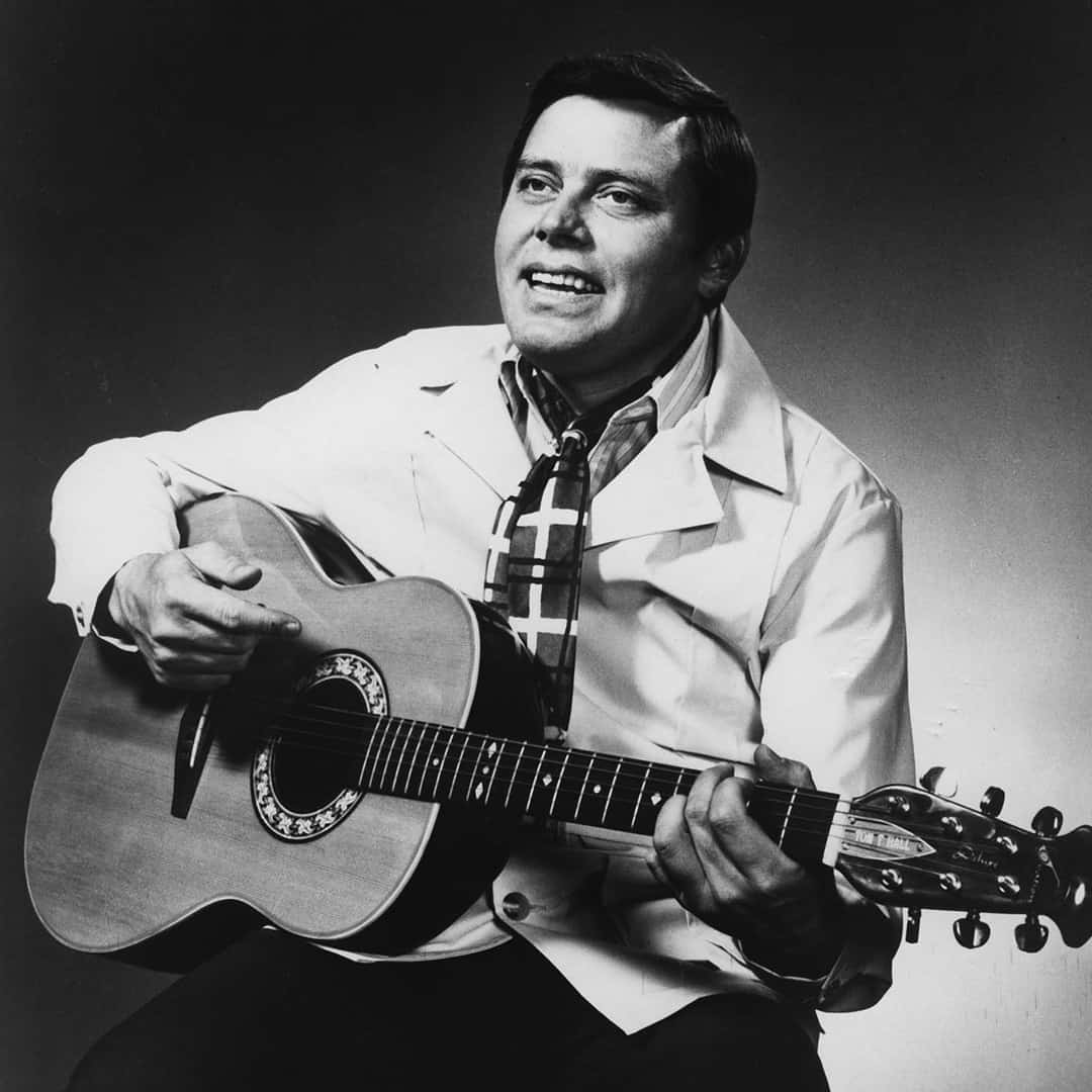 Tom T. Hall playing the classical guitar.