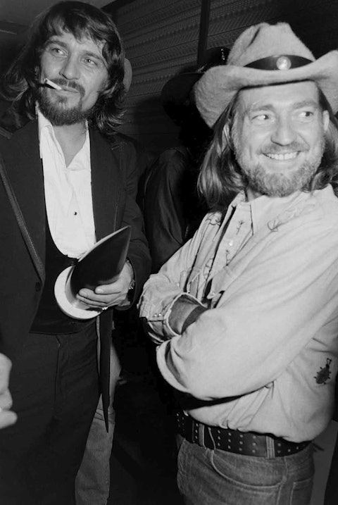Waylon Jennings and Willie Nelson, backstage at the 1975 CMA Awards. Photo by Raeanne Rubenstein.