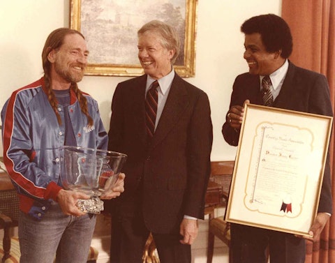 Willie Nelson and Charley Pride present President Jimmy Carter with the Special Presidents Award, voted by the CMA Board, in appreciation of his support of country music, 1979.