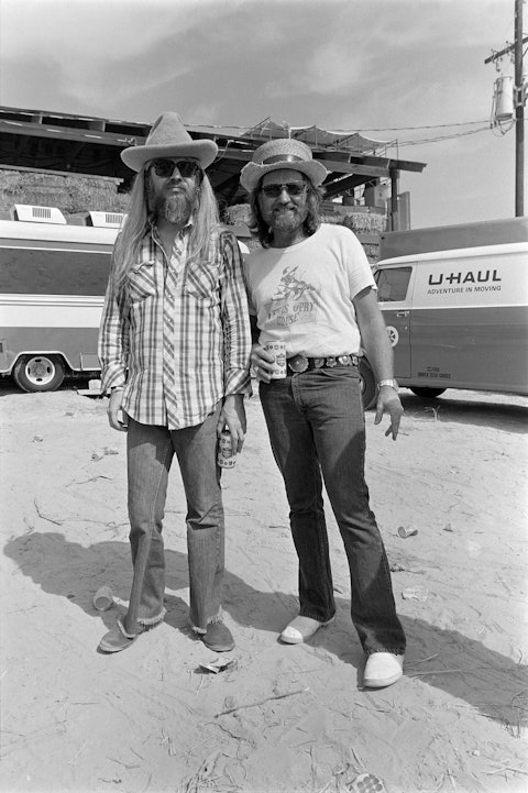 Leon Russell and Willie Nelson at the Second Annual Willie Nelson 4th of July Picnic, Bryan, Texas, 1974. Photo by Raeanne Rubenstein.