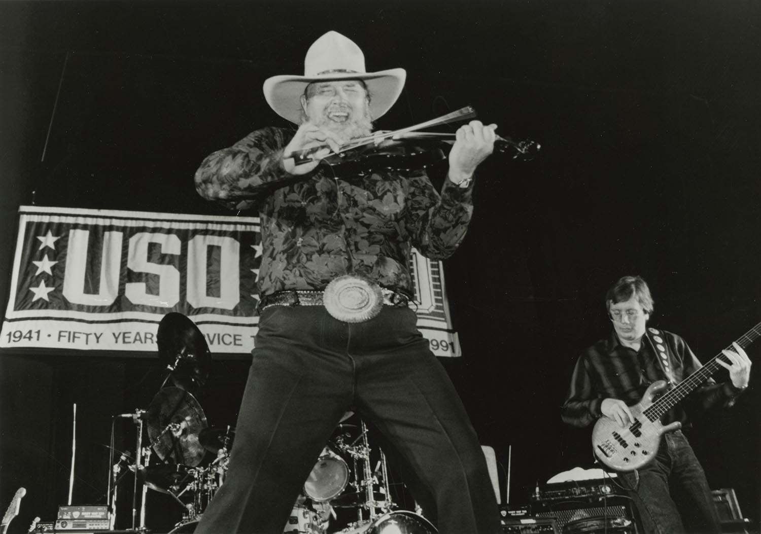 Charlie Daniels and bassist Charlie Hayward perform at Guantanamo Bay Naval Base in Cuba, 1992.
