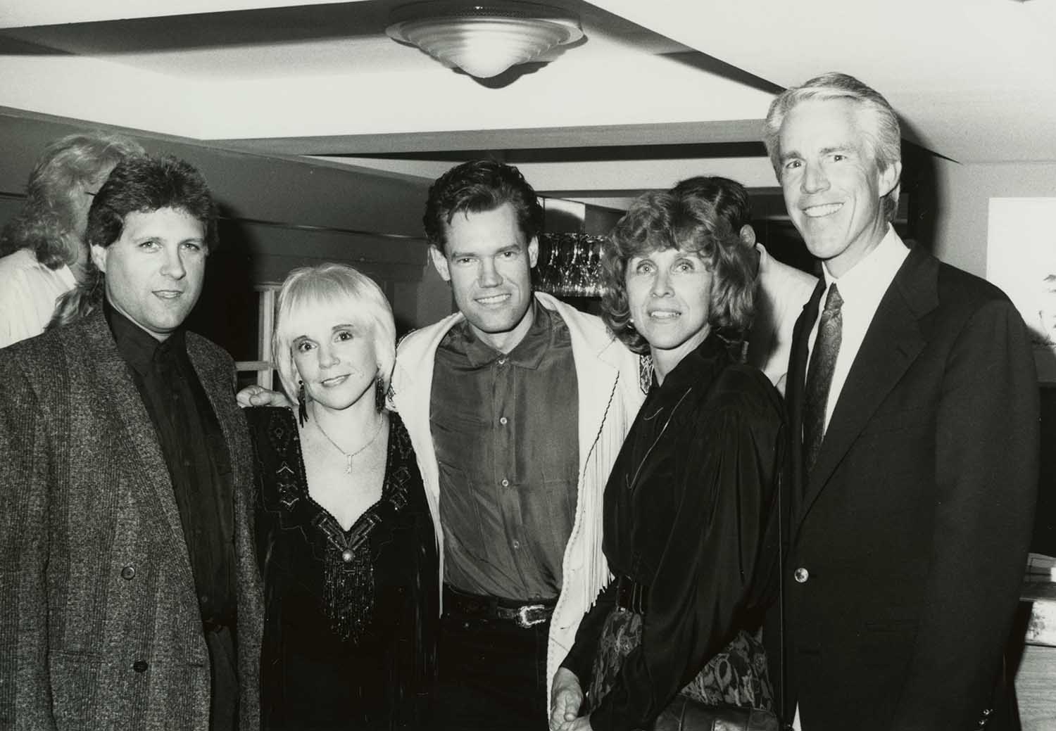 Celebrating the 1992 release of Randy Travis’s Greatest Hits, Volumes One and Two are (from left) Travis’s producer Kyle Lehning, wife and manager Lib Hatcher-Travis, Senior VP of A&R for Warner Bros. Records Nashville Martha Sharp, and Warner Bros. Nashville President Ed Norman.
