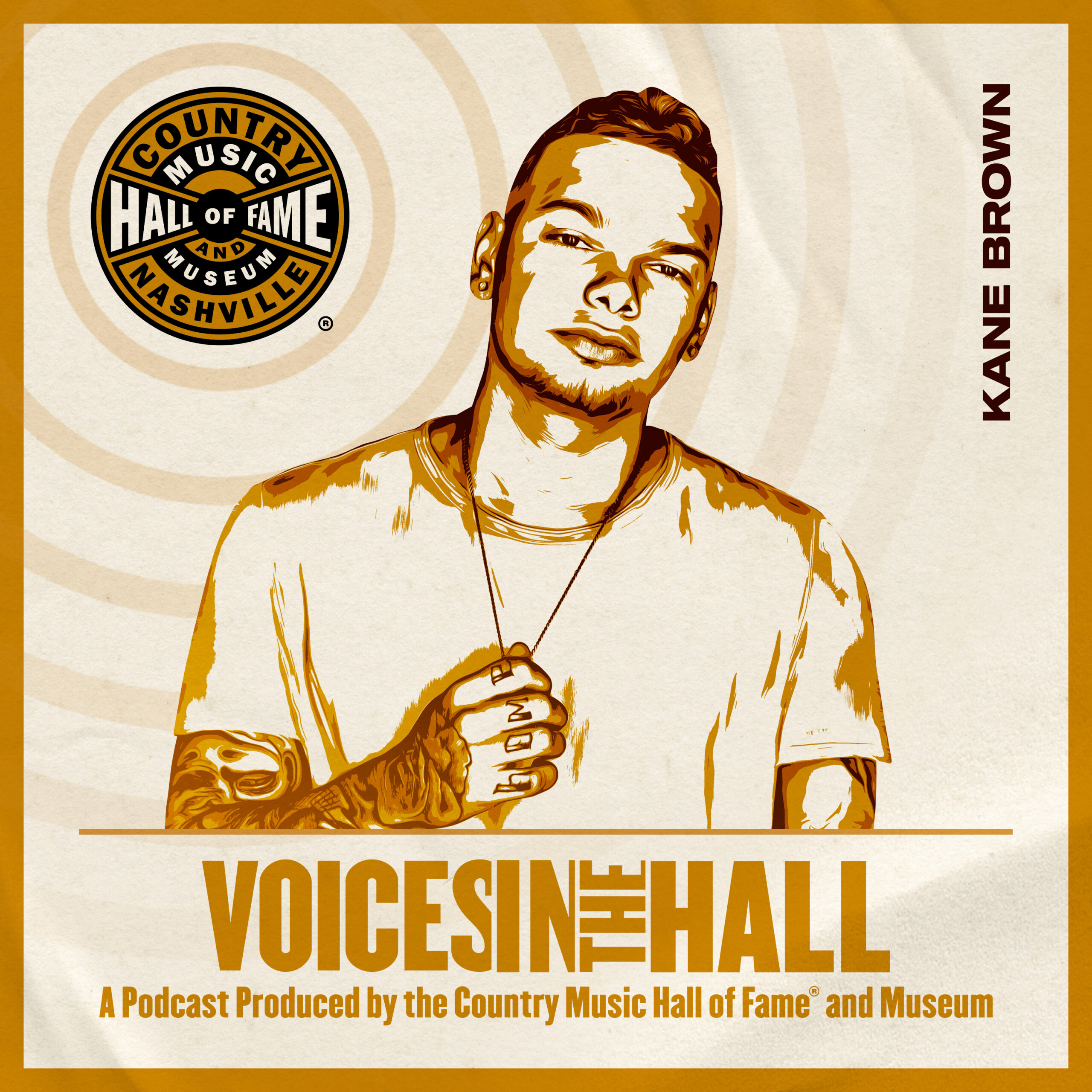 S2E1: Kane Brown on Country Music Hall of Fame and Museum’s “Voice in the Hall” Podcast. Brown is wearing a white t-shirt, holding his necklace.