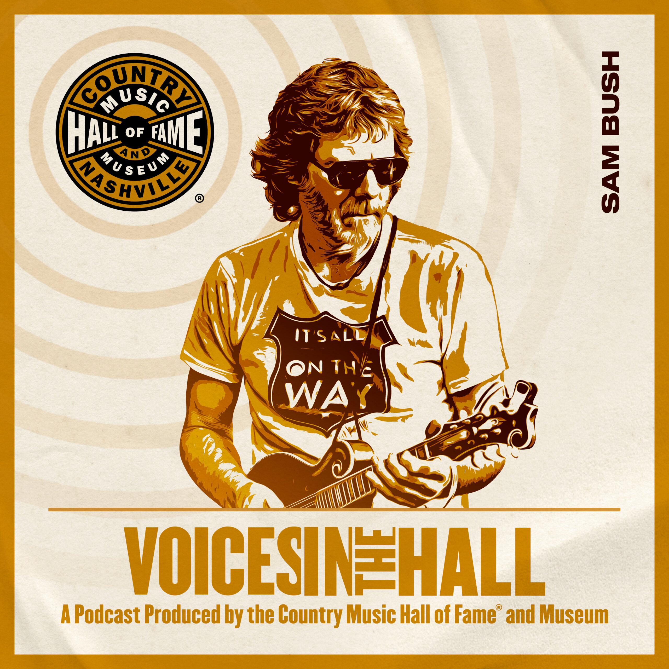 S2E5&6: Sam Bush on Country Music Hall of Fame and Museum’s “Voice in the Hall” Podcast. Bush is playing an electric guitar, rockin' some shades.