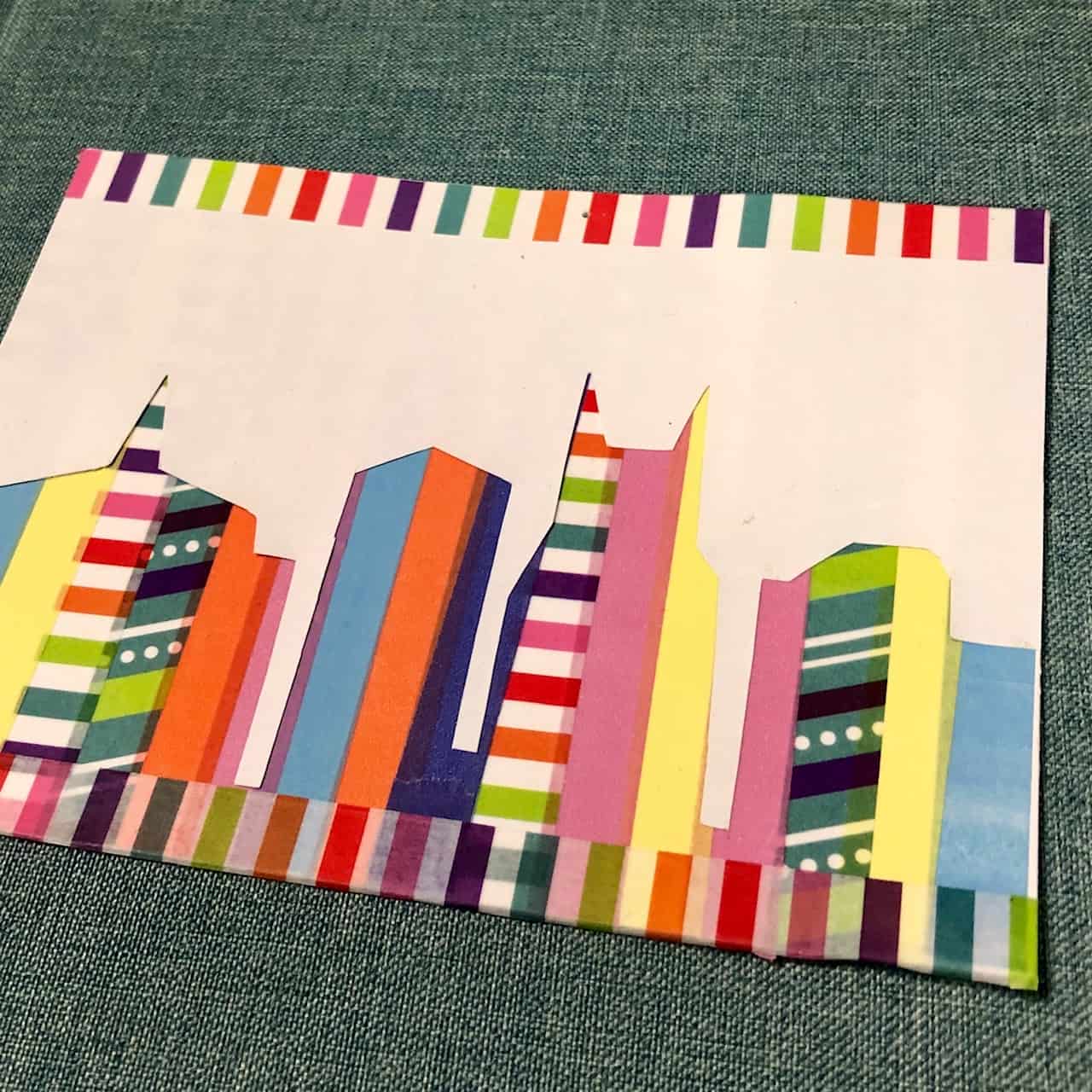 Postcard with rainbow buildings.