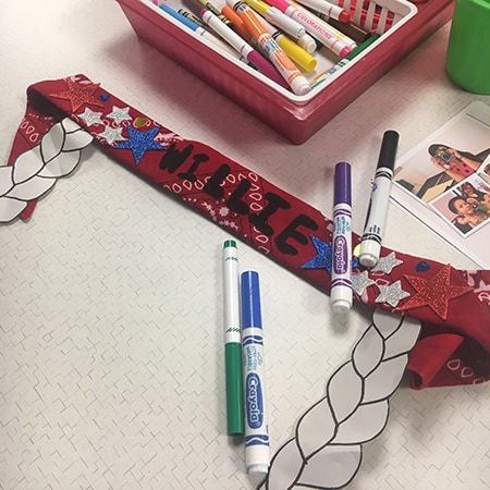 Photo of a rolled up bandana with paper cutout 