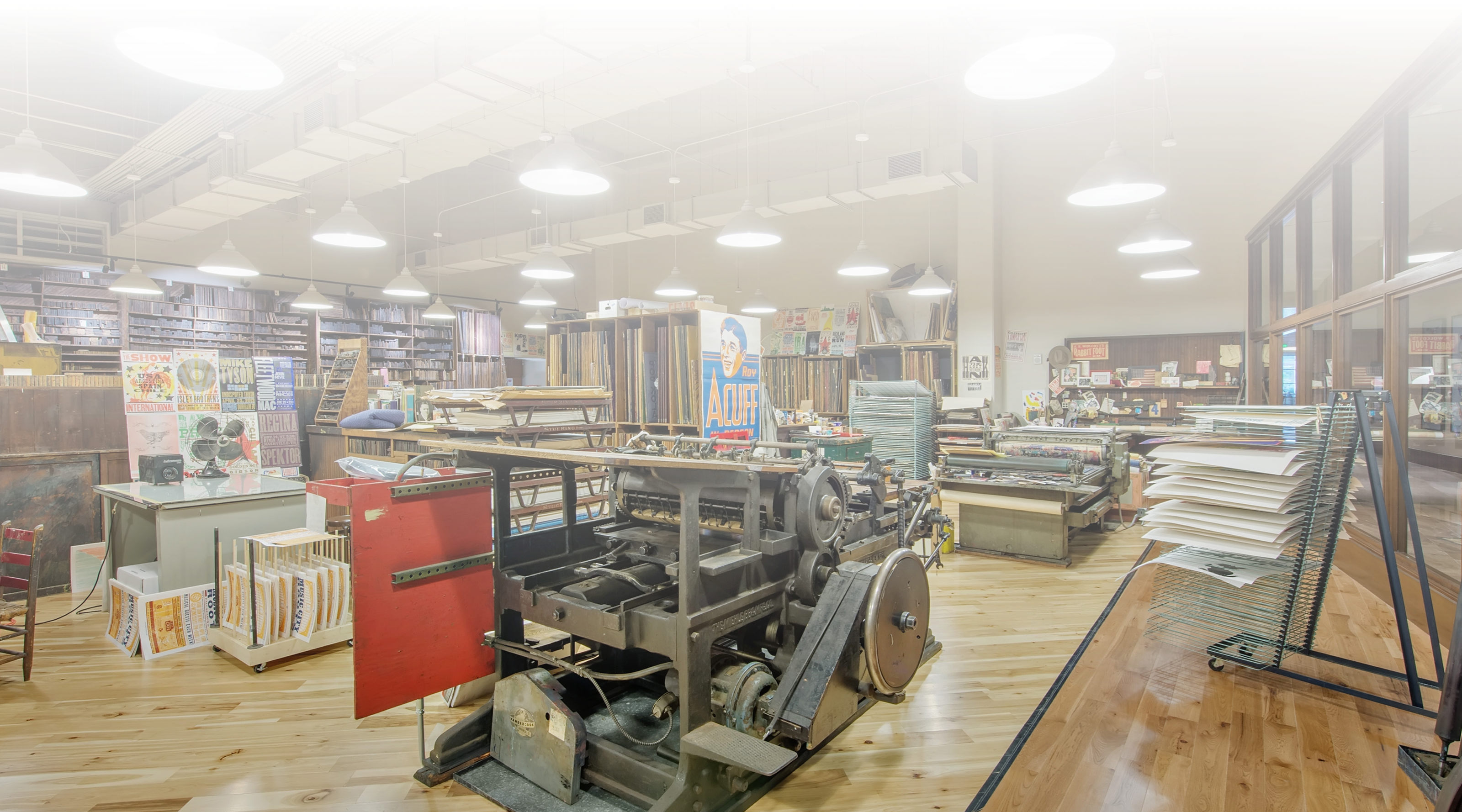 Full-view photo of Hatch Show Print's workspace and printing press.