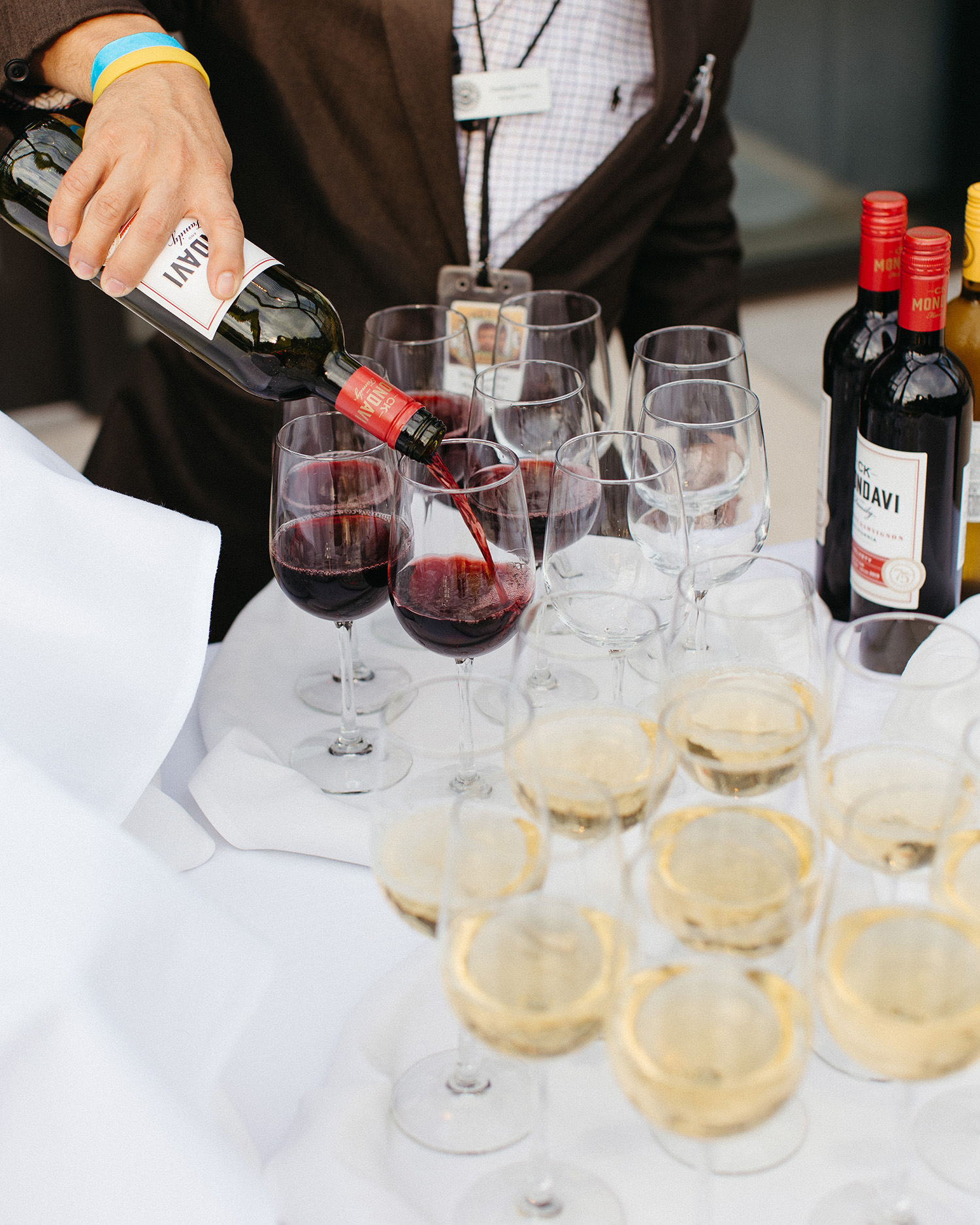 Wine being poured into glasses. Book your Nashville Event Venue and enjoy our services.