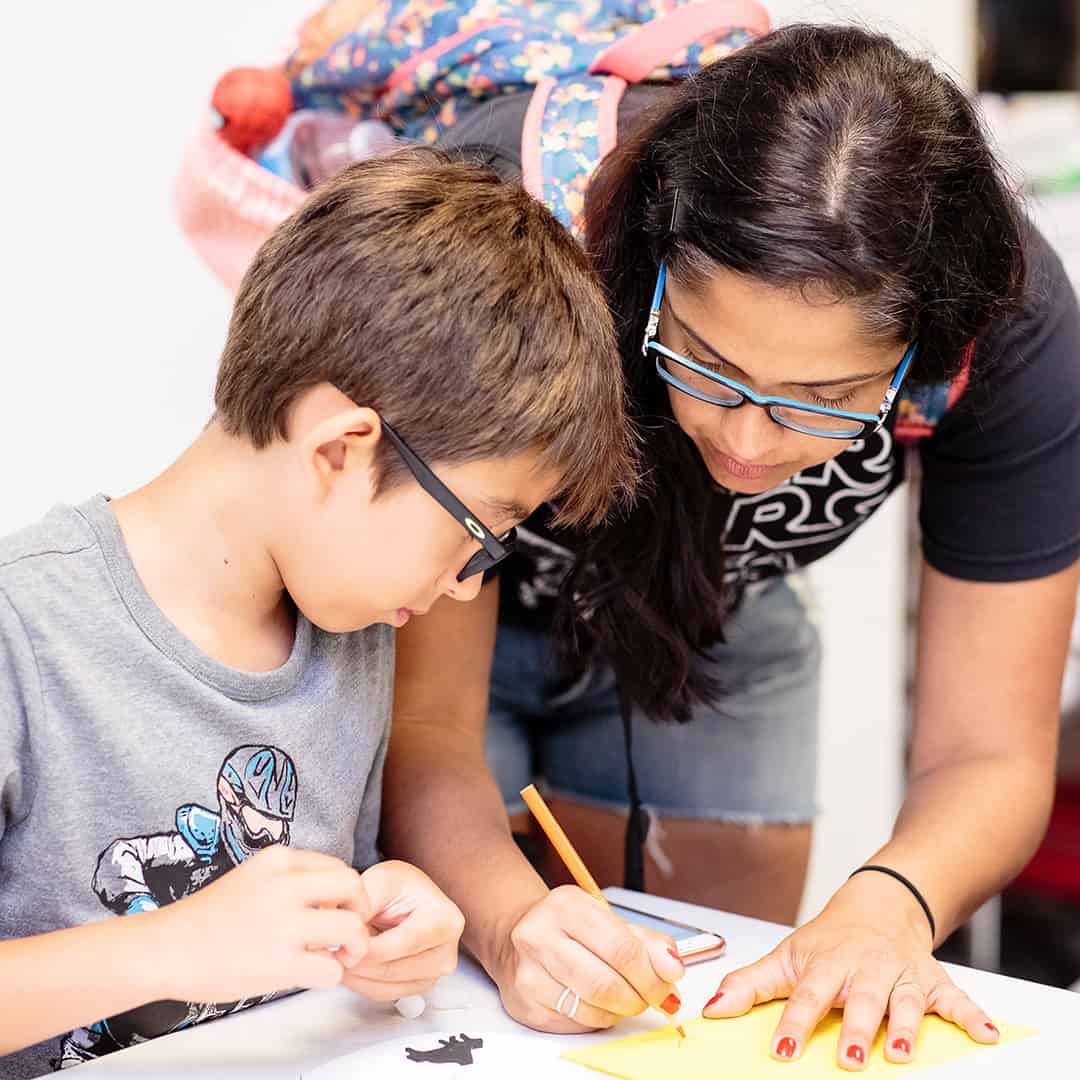 Two Museum guests working on children's craft project