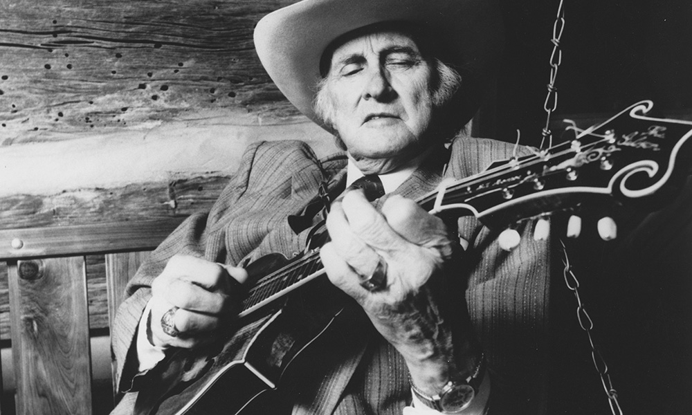 photograph of man playing a guitar