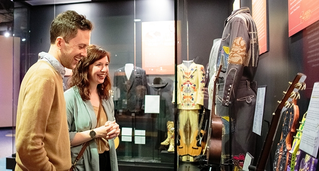 Two Guests looking at a display in the Museum.