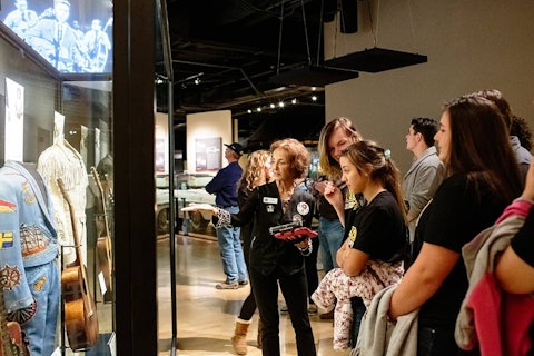 Volunteer helping guests at an exhibit