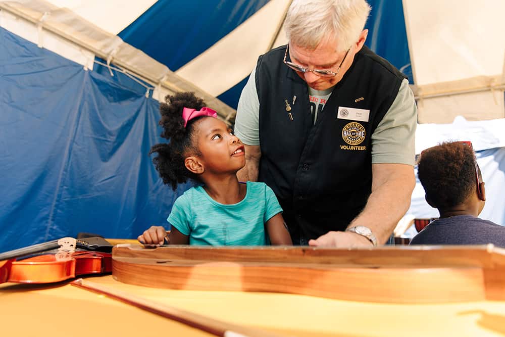 Volunteer helping a child