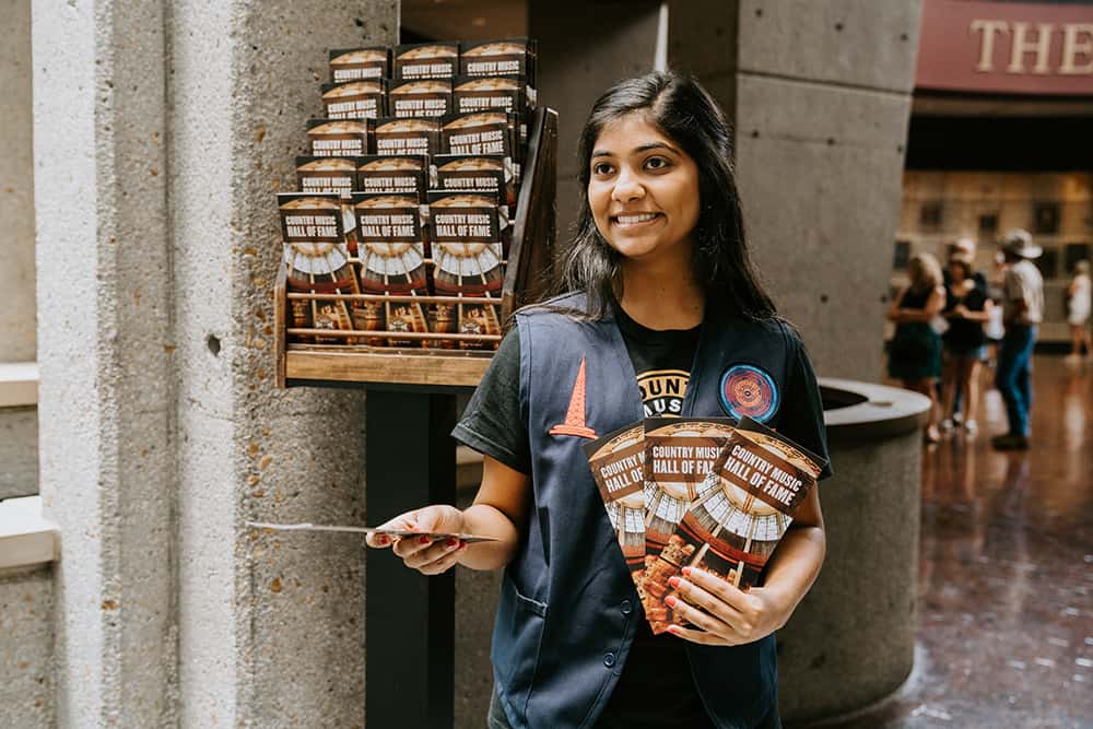 Teenager handing out a pamphlet