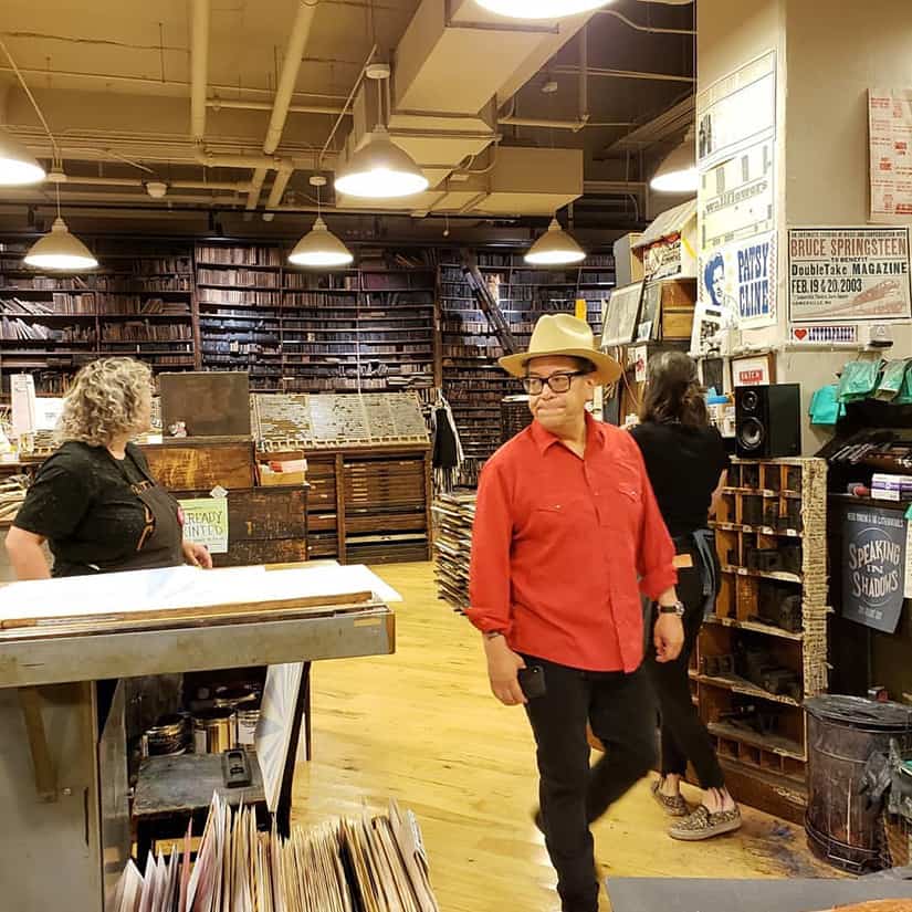 Carlos walking through gallery