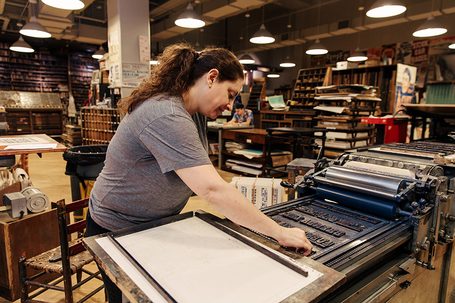 Person printing with letterpress