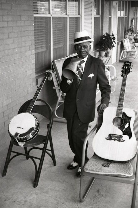 DeFord Bailey with his guitar and banjo