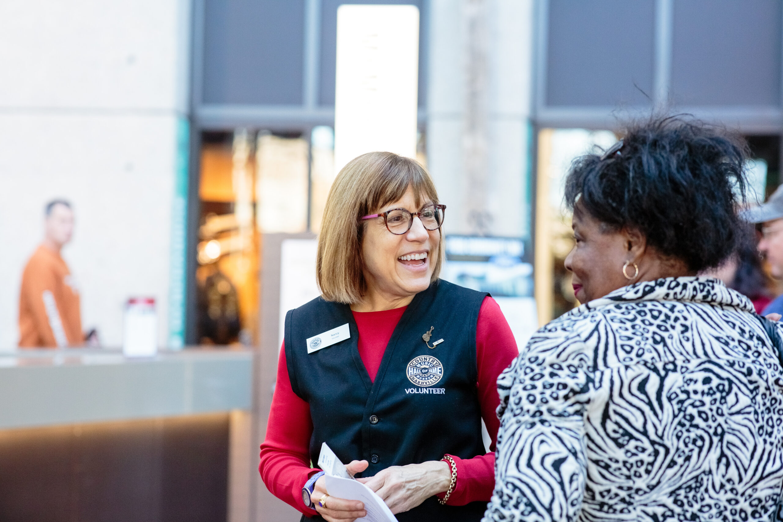 Nancy Kruh welcoming a guest