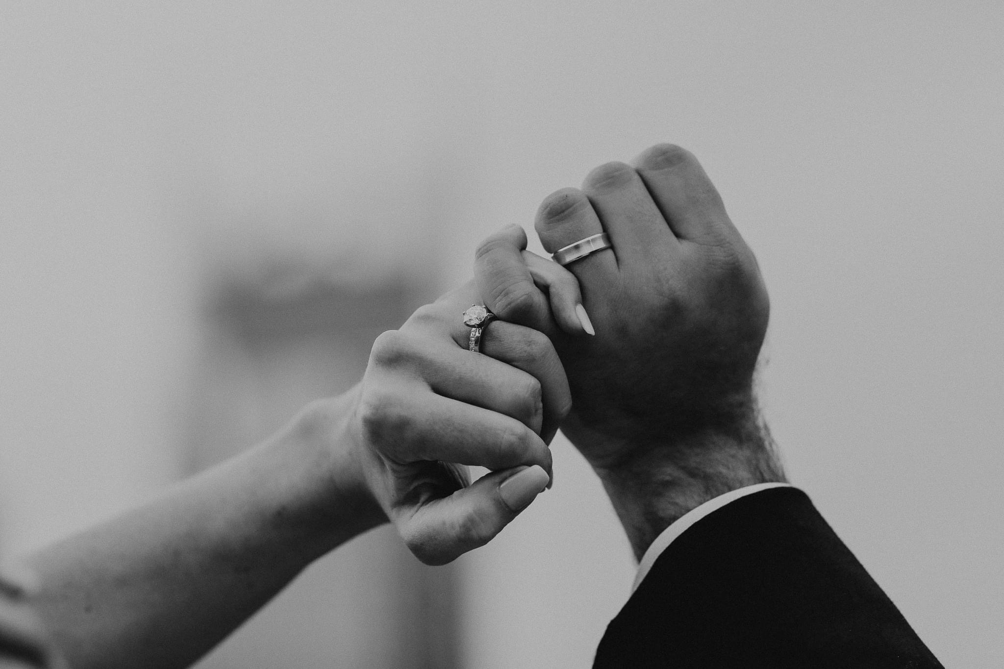 Bride and Groom hold hands at during a wedding at our downtown Nashville wedding venue.