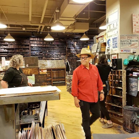 Carlos walking through gallery