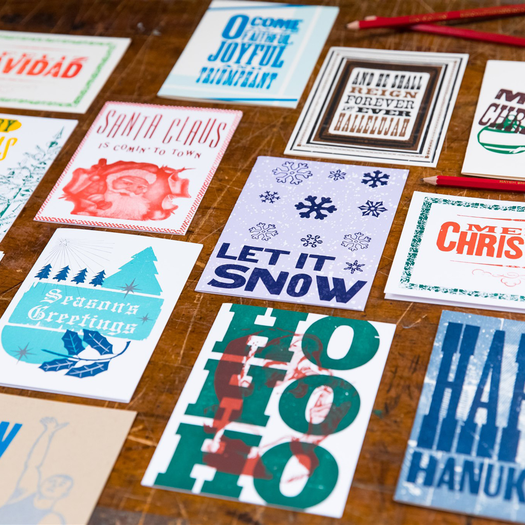 Hatch Show Print Holiday Cards laid out on a table.