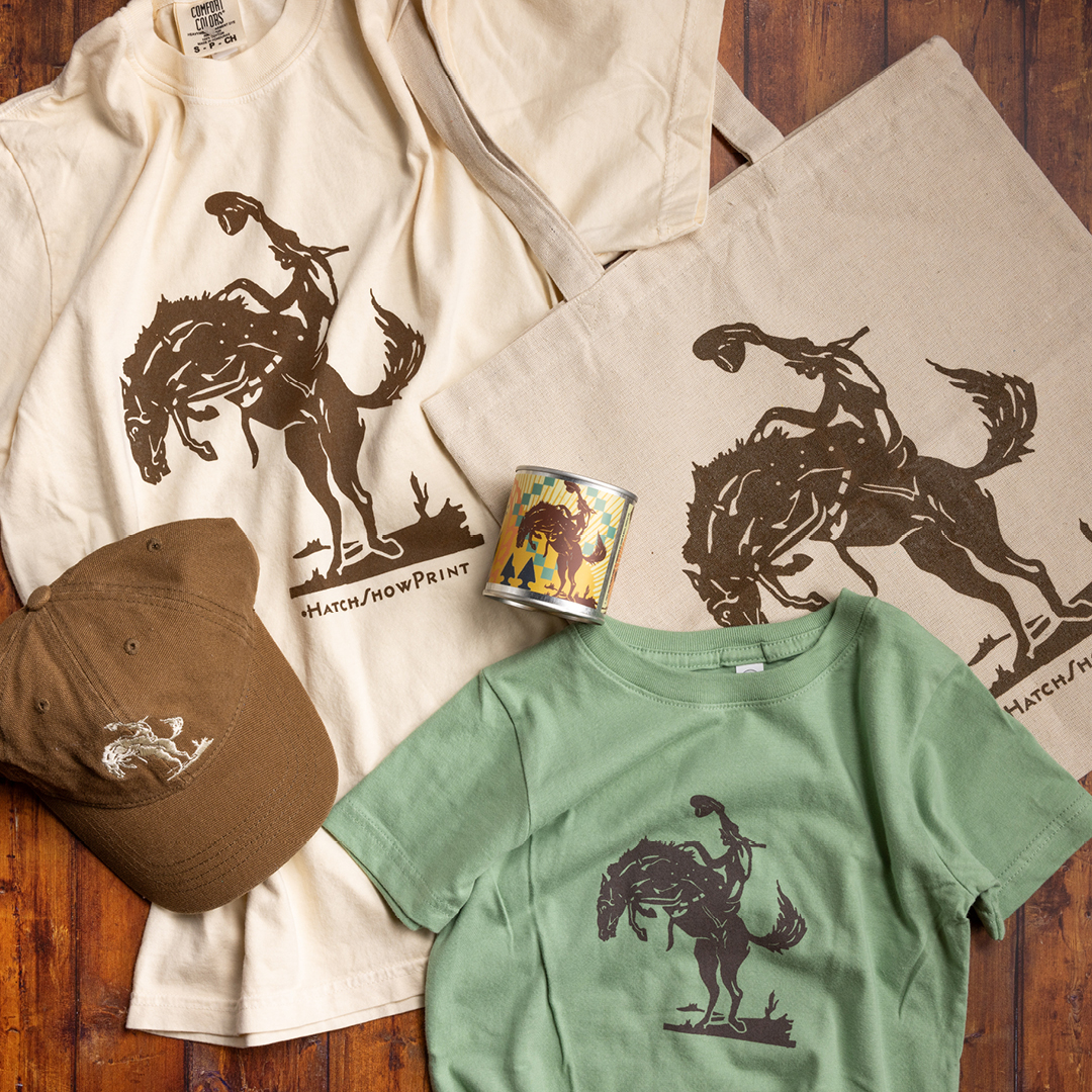 Apparel, hats, tote bag, and candle featuring iconic Hatch Show Print Imagery.