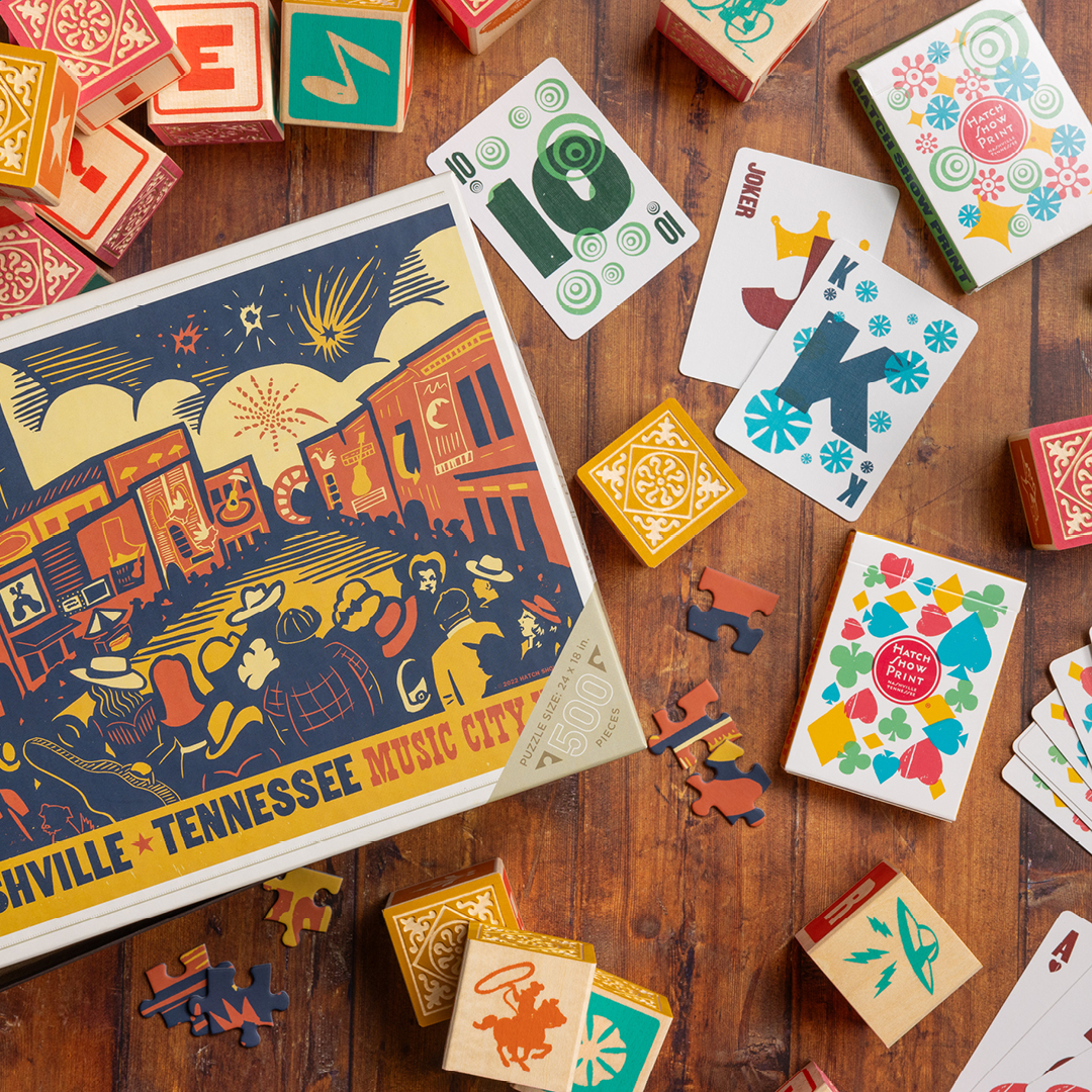 Puzzle and cards featuring Hatch Show Print designs.
