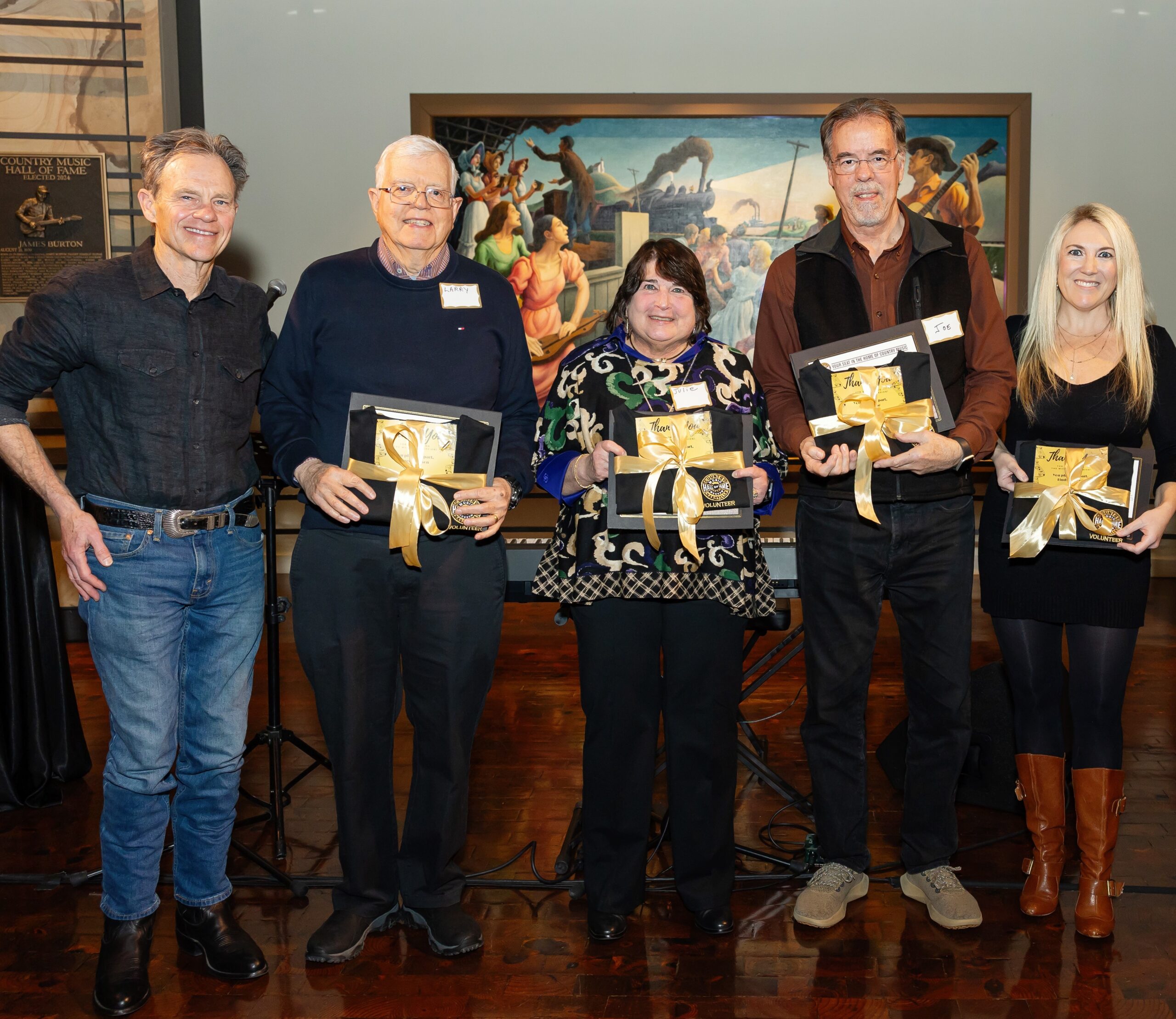 Award-winning songwriter Tom Douglas with volunteer honorees: Larry Johnson, Julie Bayhi, Joe Haase, and Lindsey Read.
